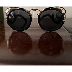 Limited edition Prada baroque black gold accents. Never worn w/ org box & case